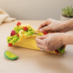 Tapis de fouille ludique en forme de taco pour chien avec intérieur garni de jouets à friandises, idéal pour stimuler l'instinct de recherche et l'enrichissement mental.